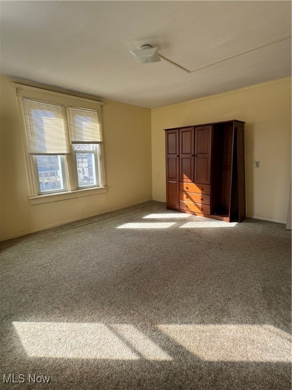 unfurnished bedroom with carpet and ceiling fan