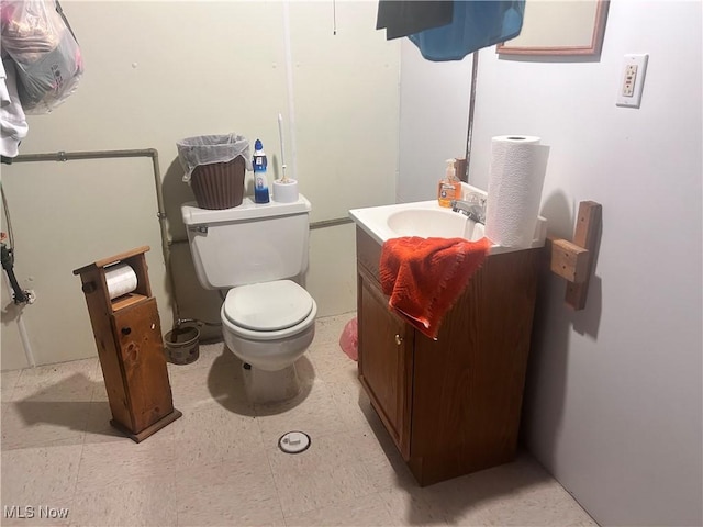 bathroom featuring toilet and vanity