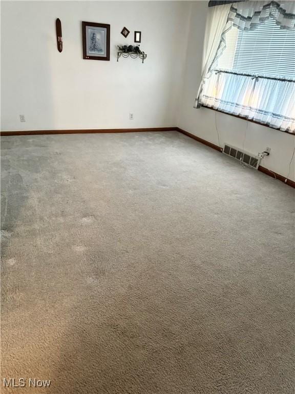 empty room with carpet flooring