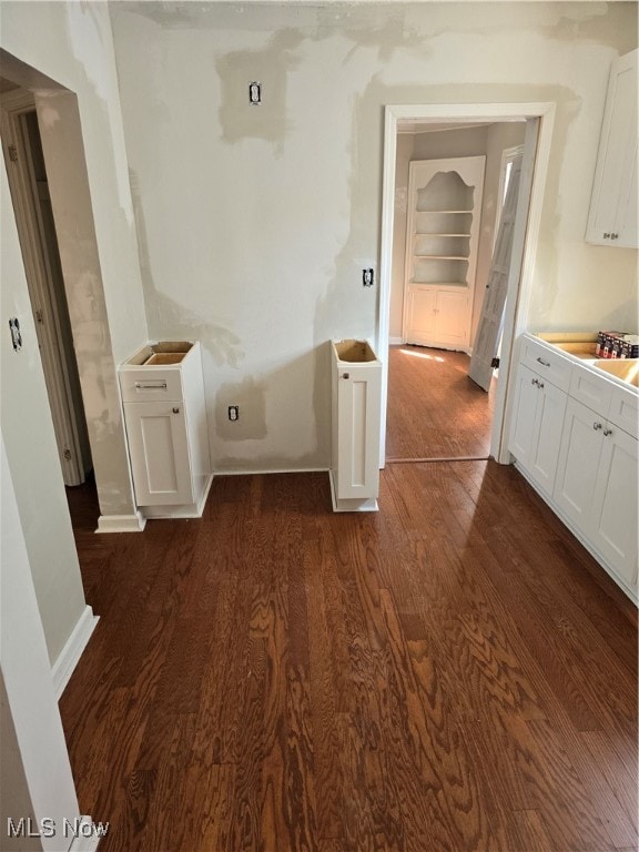 interior space with dark hardwood / wood-style floors