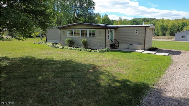 rear view of house with a lawn