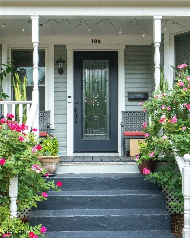 property entrance featuring covered porch