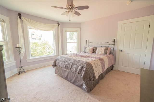 carpeted bedroom featuring ceiling fan