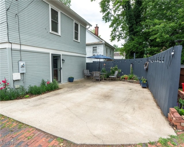 back of house with a patio