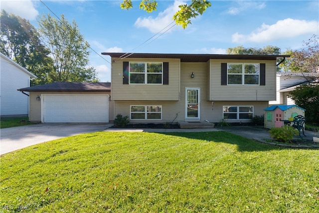 bi-level home featuring a front yard and a garage