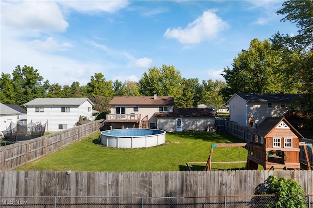 view of yard with a storage unit and a fenced in pool