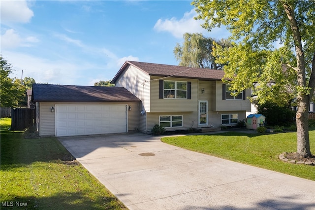 split foyer home with a front yard and a garage