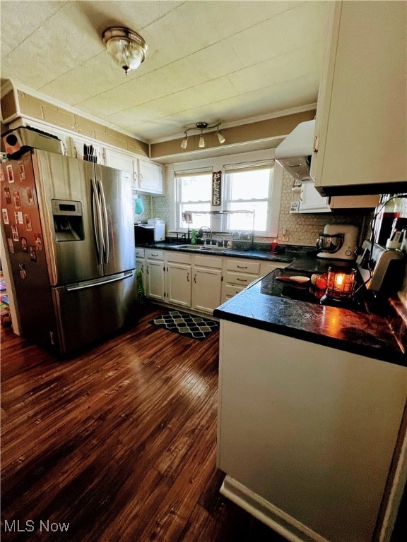 kitchen featuring white cabinets, tasteful backsplash, stainless steel fridge with ice dispenser, dark hardwood / wood-style floors, and range hood