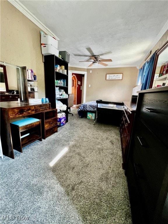 bedroom featuring a textured ceiling, carpet flooring, and crown molding