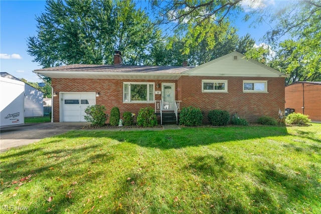 ranch-style home with a front lawn and a garage