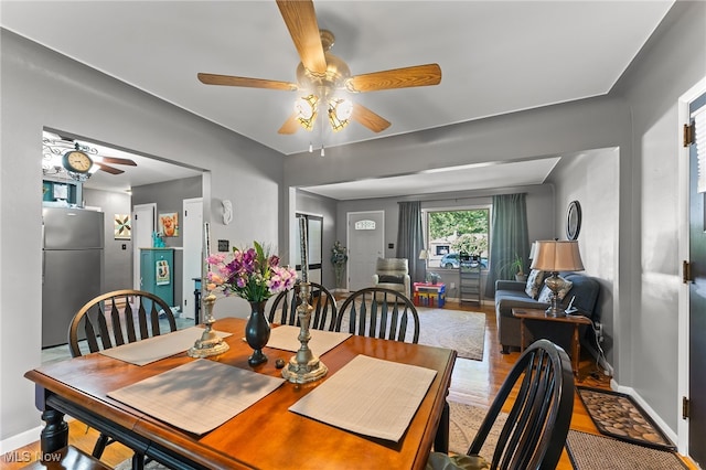 dining room featuring ceiling fan and hardwood / wood-style flooring