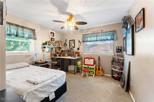 bedroom featuring light carpet and ceiling fan