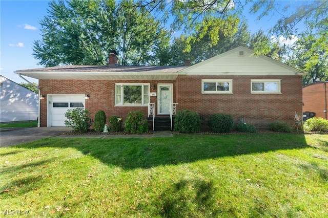 view of front facade featuring a garage and a front lawn