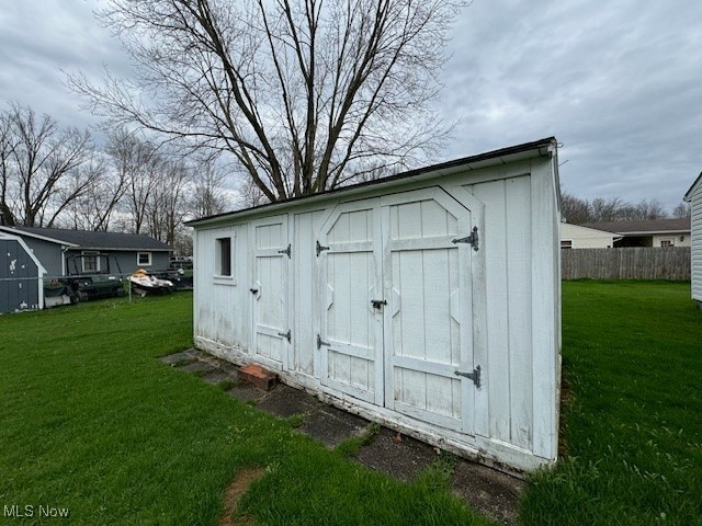 view of outdoor structure with a lawn