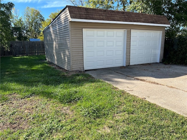 garage with a lawn