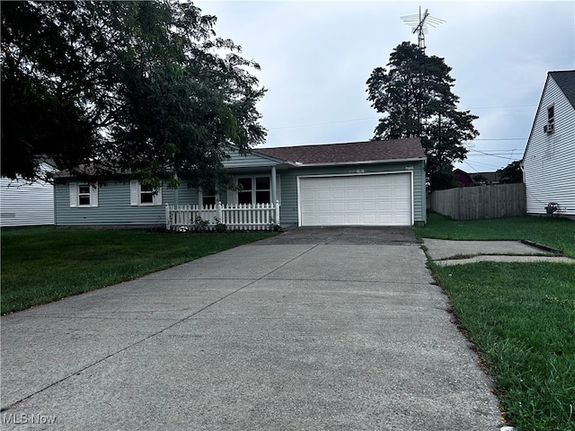 view of front facade featuring a front yard and a garage