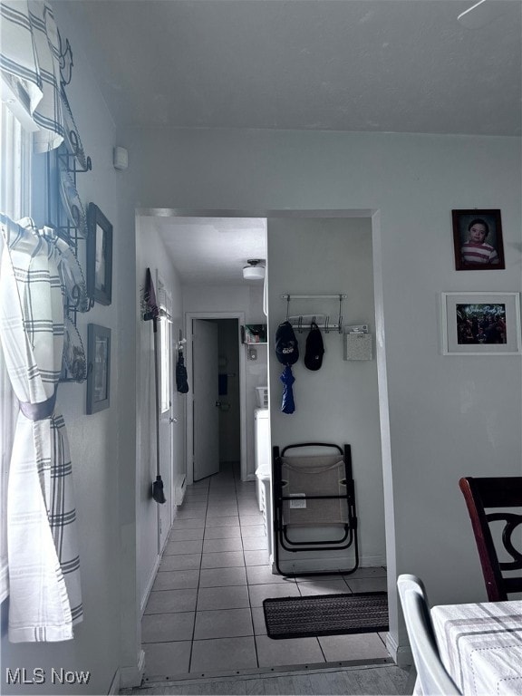 corridor with tile patterned flooring