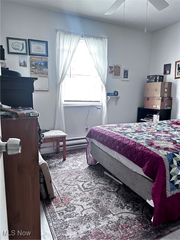 bedroom with ceiling fan and hardwood / wood-style flooring