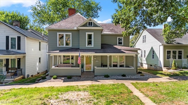 view of property featuring a front yard and covered porch