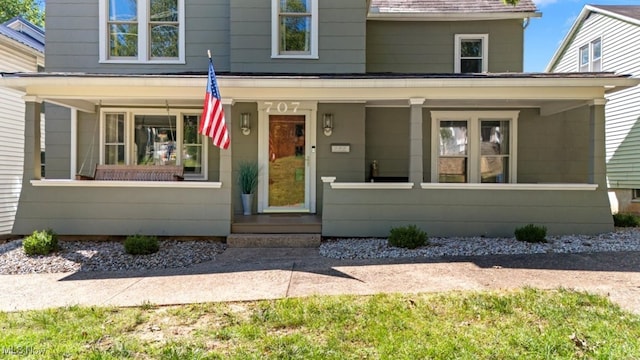 view of front of property featuring covered porch