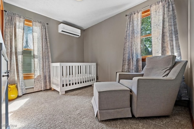 bedroom with a nursery area, carpet, multiple windows, and an AC wall unit