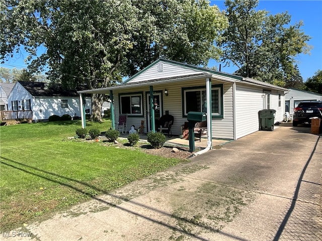 view of front of home featuring covered porch and a front lawn