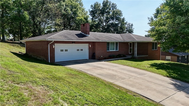 ranch-style house with a garage and a front lawn