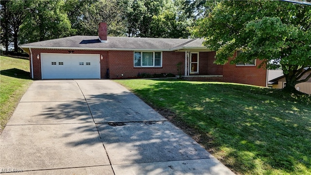 single story home featuring a front yard and a garage