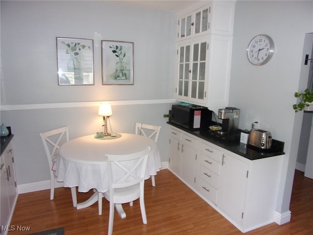 dining area with light hardwood / wood-style flooring