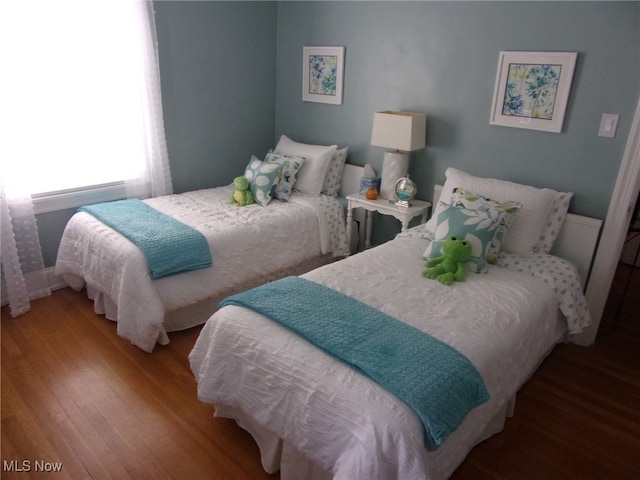 bedroom featuring hardwood / wood-style floors