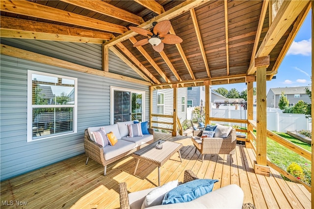 deck featuring ceiling fan and an outdoor hangout area