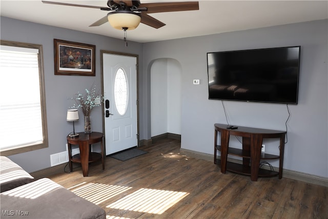 foyer entrance with ceiling fan, dark hardwood / wood-style flooring, and a healthy amount of sunlight