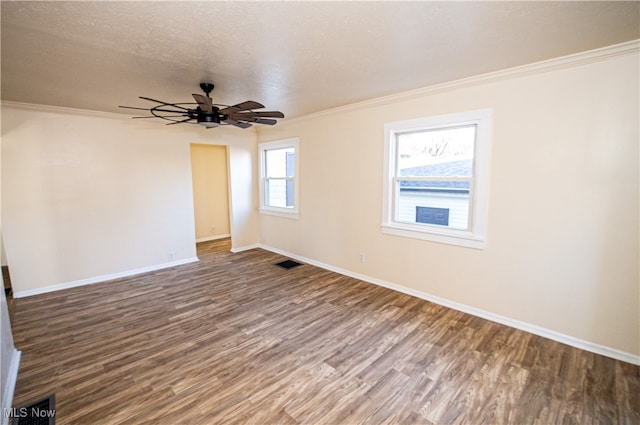 empty room with wood-type flooring, a textured ceiling, crown molding, and ceiling fan