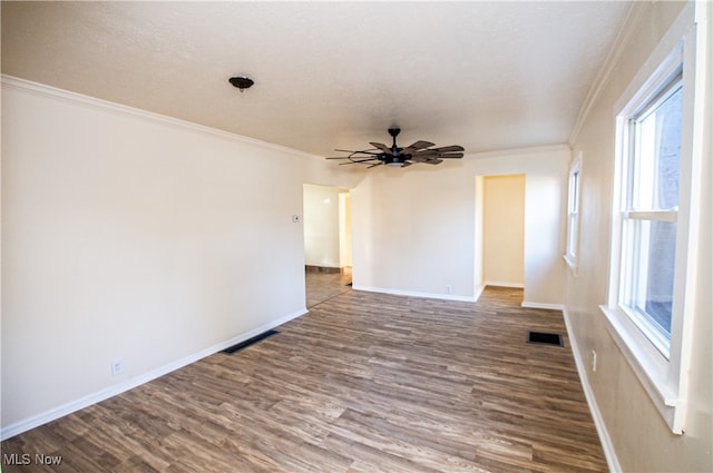 unfurnished room with ceiling fan, hardwood / wood-style flooring, crown molding, and a textured ceiling