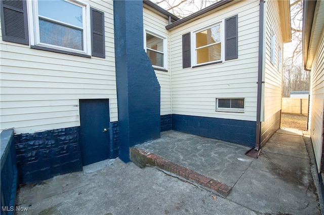 property entrance with a patio