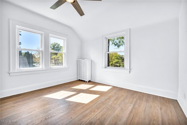 bonus room with vaulted ceiling, ceiling fan, light hardwood / wood-style flooring, and plenty of natural light