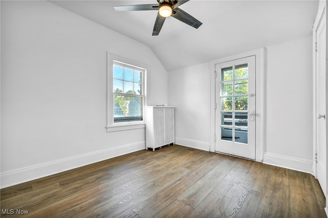 unfurnished room featuring wood-type flooring, vaulted ceiling, and ceiling fan