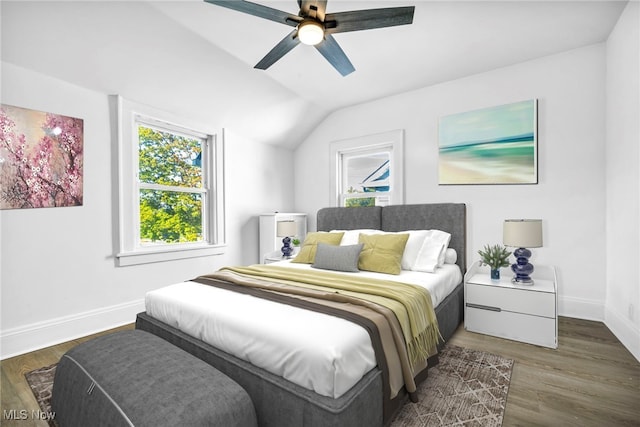 bedroom with lofted ceiling, dark hardwood / wood-style flooring, and ceiling fan