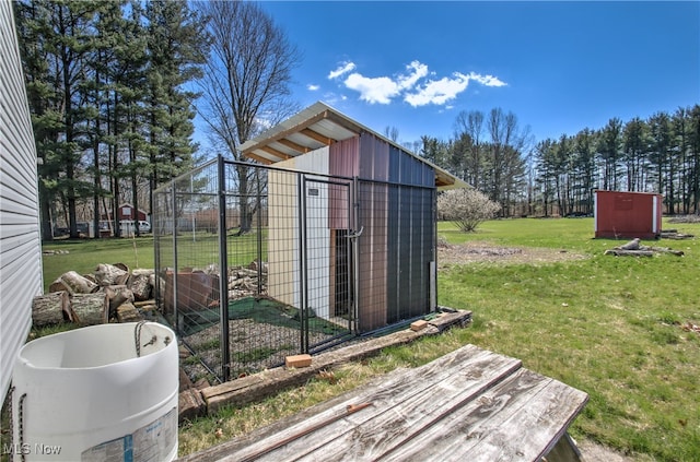 view of outdoor structure featuring a lawn