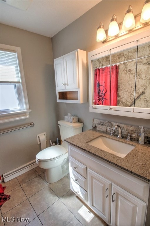 bathroom with a baseboard radiator, tile patterned flooring, vanity, and toilet