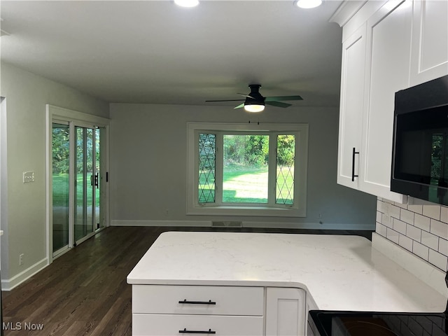 kitchen featuring white cabinetry, ceiling fan, dark hardwood / wood-style flooring, and plenty of natural light