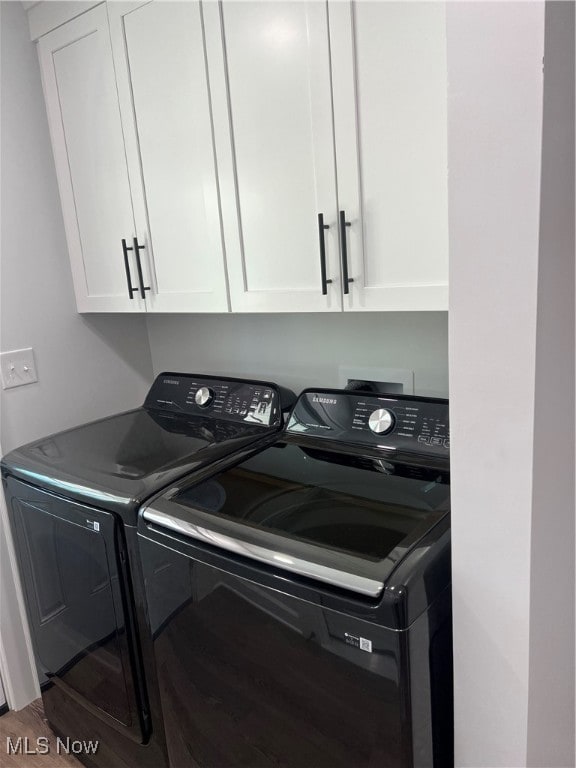 laundry area featuring cabinets and washer and dryer