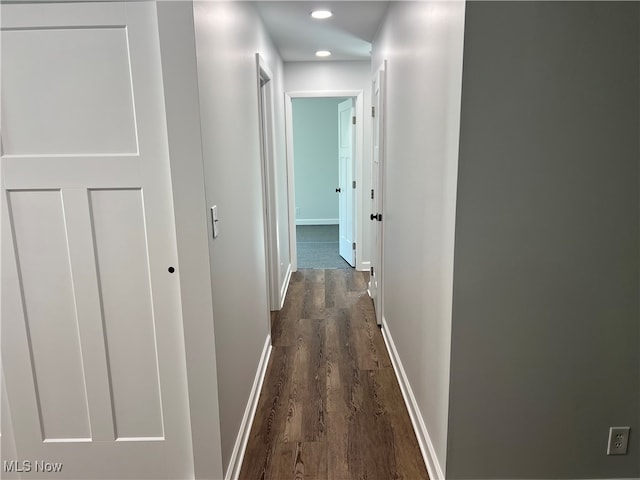 corridor with dark hardwood / wood-style floors