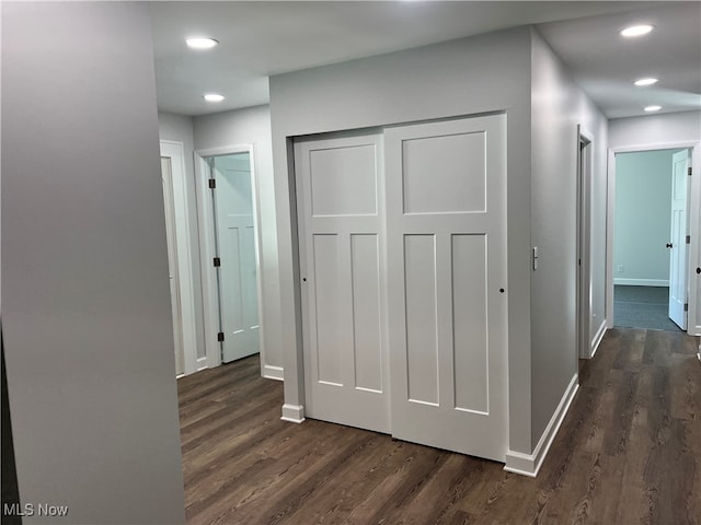 corridor with dark hardwood / wood-style floors