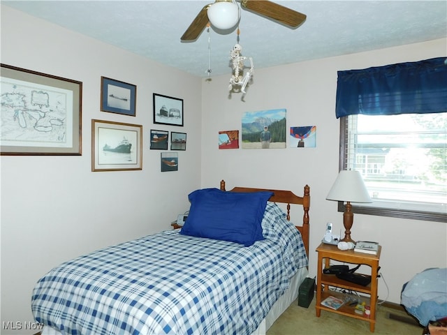 bedroom featuring ceiling fan and carpet floors