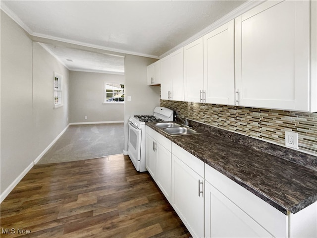 kitchen featuring backsplash, white cabinetry, dark hardwood / wood-style flooring, and white gas stove