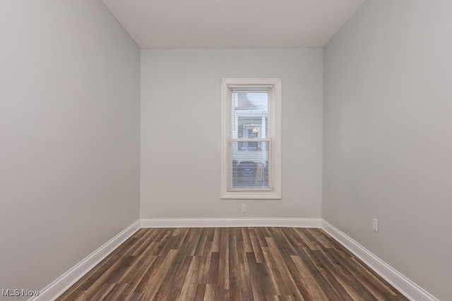 unfurnished room featuring dark hardwood / wood-style floors