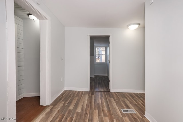 empty room featuring dark hardwood / wood-style floors