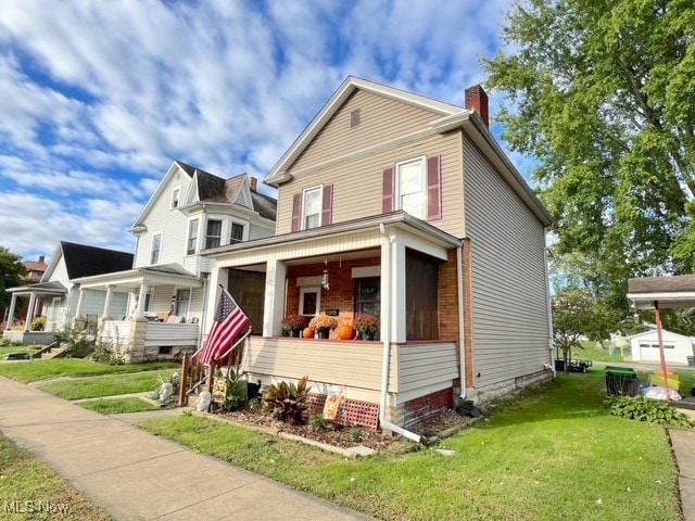 view of front facade with a porch and a front yard