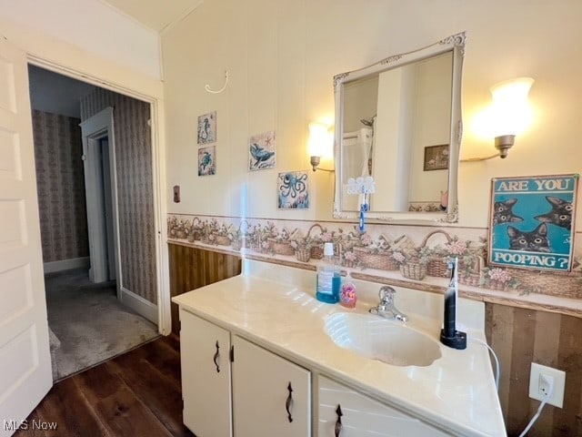 bathroom featuring vanity and hardwood / wood-style flooring